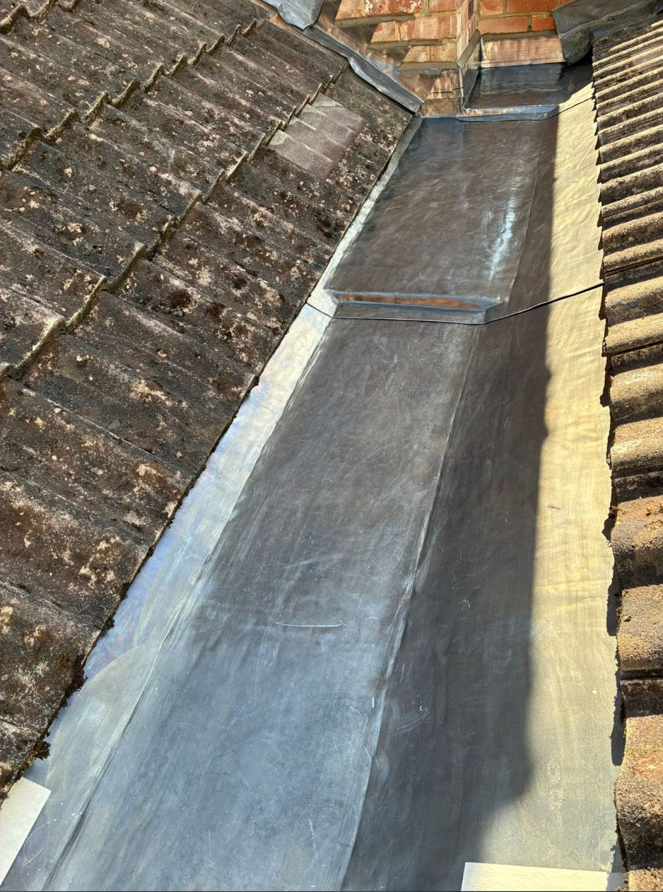 Completed stepped new lead roof valley.