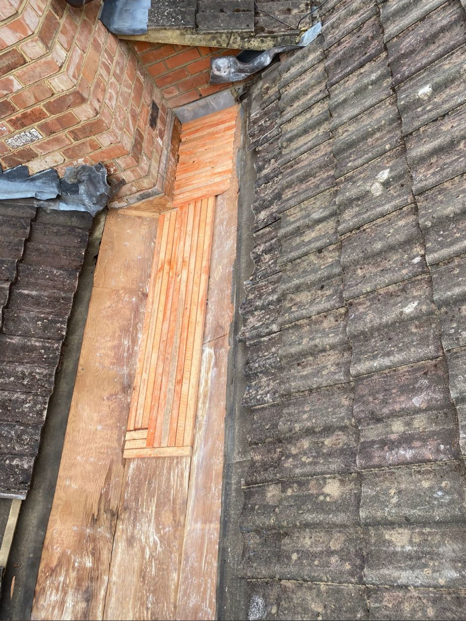 New roof valley base board to replace old leaking valley.
